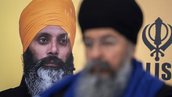 A photo of Hardeep Singh Nijjar is seen during a news conference providing an update from the Sikh community about Nijjar’s homicide.