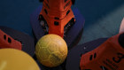 The robots surround the soccer ball.