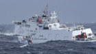 A Taiwanese coast guard vessel chases after a Chinese ship off the coast of Hualien, eastern Taiwan in December.
