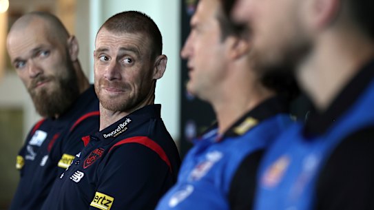 Demons coach Simon Goodwin looks on as Bulldogs counterpart Luke Beveridge speaks to the media on Friday.