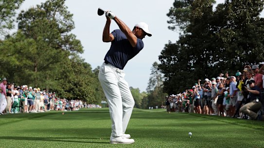 A bumper crowd watches Tiger Woods in practice ahead of the 2022 Masters Tournament.