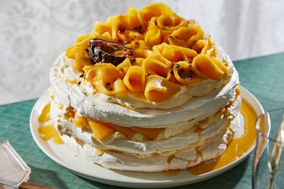Pavlova stack with passionfruit and mango.
