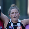 Brianna Davey leaves the field injured during round one. 