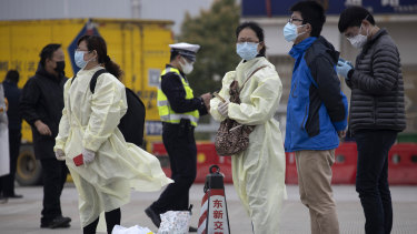 Residents waiting to enter Wuhan in April.