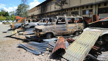 Burnt out vehicles in a car park after Monday's violent protest in Wamena, Papua province, Indonesia.