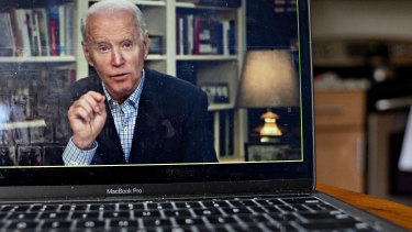 Former vice-president Joe Biden speaks during a virtual press briefing on a laptop computer in Arlington, Virginia.