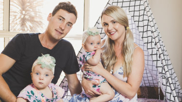 Luke and Teri Greenhalgh at home in Canberra with their twins Dahli and India, who were born premature but are now thriving.