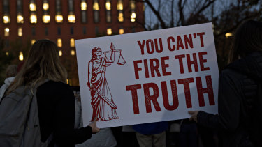 Demonstrators, calling for the recusal of acting Attorney General Matthew Whitaker in overseeing Special Counsel Robert Mueller, holds a "You Can't Fire The Truth" sign outside the White House in Washington, DC.