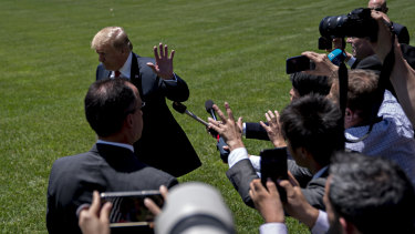 Donald Trump finishes speaking to the media before flying to Japan.
