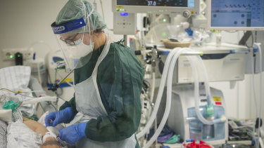 A nurse looks after a COVID-19 patient in the intensive care unit of a hospital in Essen, Germany this week.