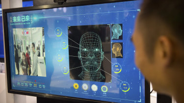 A facial recognition display by Chinese tech firm Ping'an Technology at the Global Mobile Internet Conference in Beijing. 