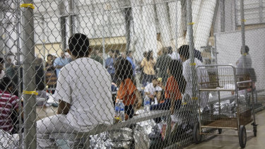 Migrant children taken into custody at the US-Mexico border await their fate in a Texas migrant camp in June.