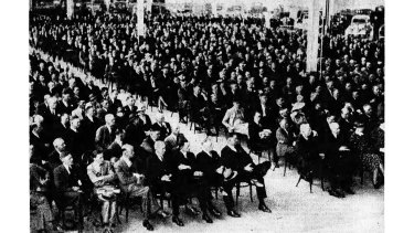 A large crowd gathered in the assembly department of General Motors-Holden Ltd., to watch the Prime Minister (Mr. Lyons) officially open the new plant at Fishermanâ€™s Bend.