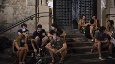 Barcelona's bars and clubs have been restricted, but young people are gathering in the streets instead.