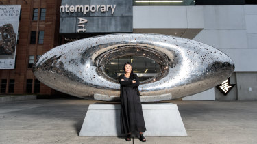Lindy Lee with her work 'Secret World of a Starlight Ember' which is installed in the forecourt of the MCA.