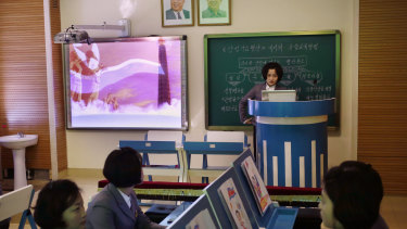 A computer generated video of North Korean flag is projected onto a screen during a multimedia class at Pyongyang Teachers' University.