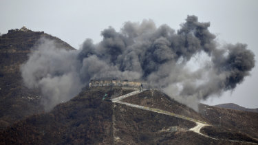 Smoke from an explosion rises last month as part of the dismantling of a South Korean guard post in the Demilitarized Zone dividing the two Koreas.