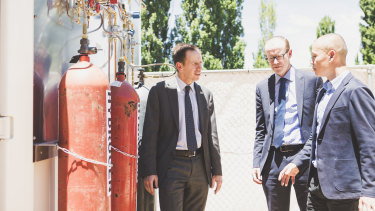 From left: Minister for Climate Change and Sustainability Shane Rattenbury, Energy Networks Australia's Andrew Dillon, and Evoenergy gas networks manager William Yeap at the opening of a hydrogen gas test facility. 