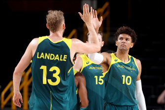 Jock Landale and Matisse Thybulle high five.
