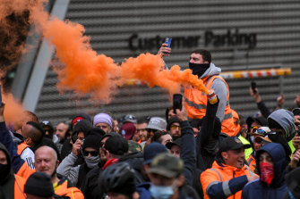 Protesters set off flares in the city.