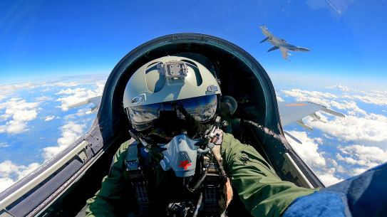 In this photo released by Xinhua News Agency, a Chinese fighter jet pilot takes part in military drills around Taiwan last weekend.