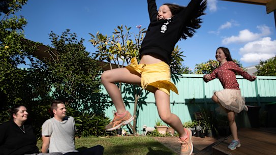 Alyce Kirk and Chris Hows with their daughters April (black top) and Violet (pink top, in Gymea.