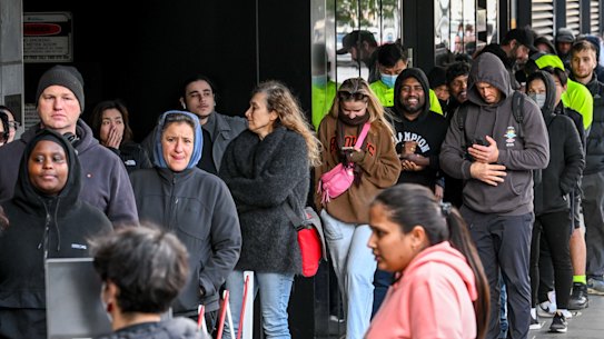 Applicants queued up for at least three hours in Melbourne on Monday to check on the status of their passports.