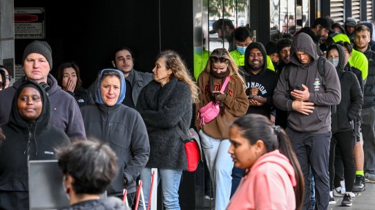 Applicants queued up for at least three hours in Melbourne to check on the status of their passports.