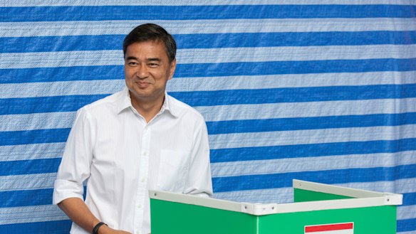 Democrat Party leader Abhisit Vejjajiva casts his vote at a polling station in Bangkok on Sunday. He has since quit after his party's poor showing.