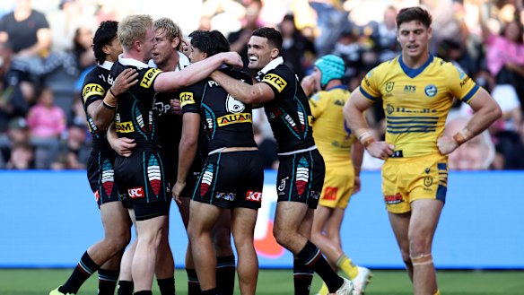 Penrith celebrate one of many tries against the Eels on Saturday.