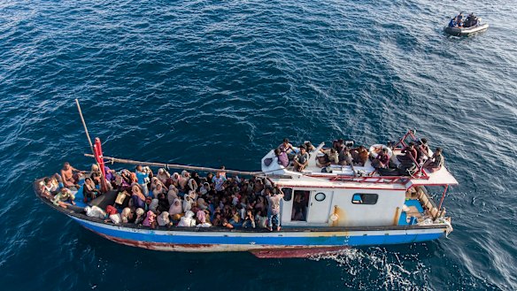 A boat carries ethnic Rohingya off North Aceh, Indonesia, on June 24.
