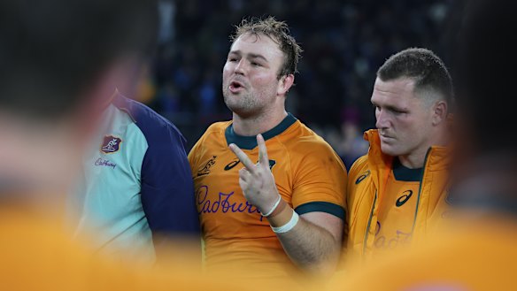 Captain Harry Wilson speaks to his team after defeat in Italy.