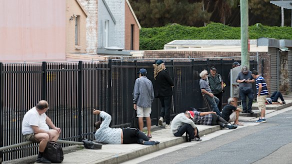 Struggling Sydneysiders line up for a free lunch outside Matthew Talbot Hostel in Woolloomooloo.