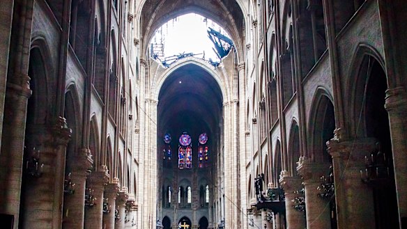 A hole is seen in the dome inside Notre Dame cathedral in Paris.