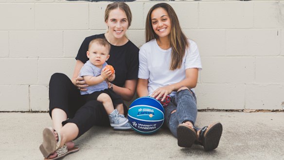Mikaela Dombkins and her partner Canberra Capitals guard Leilani Mitchell with their son Kash Mitchell-Dombkins.