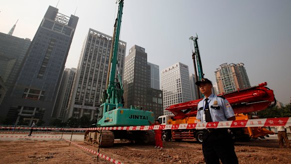 Security workers guard at construction site of the US Consulate compound in Guangzhou in southern China's Guangdong province. 