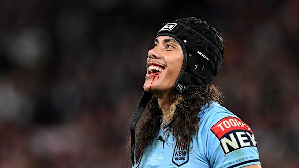 Jarome Luai smiles at the Queensland fans after getting his marching orders at Suncorp Stadium.