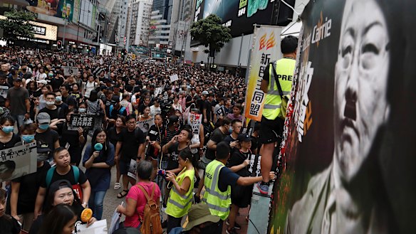 Protesters pack central Hong Kong, defying police. 