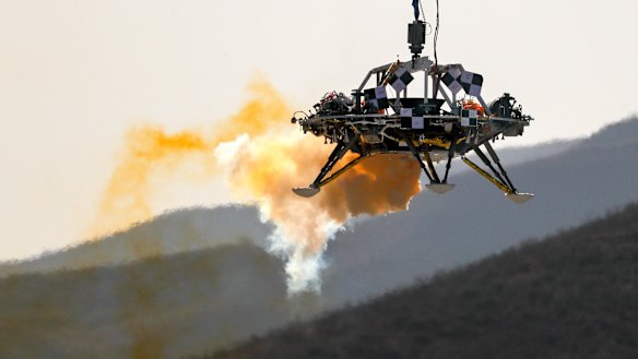 A lander is lifted during a test of hovering, obstacle avoidance and deceleration capabilities of a Mars lander at a facility in Huailai in China’s Hebei province. 