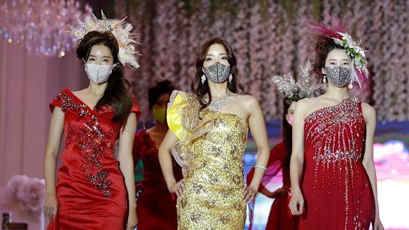 Models wearing face masks during a fashion show in South Korea in July.