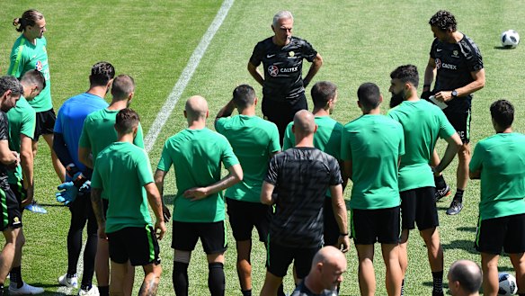 This is it: Bert van Marwijk and the Socceroos players go through final preparations for the Peru match.