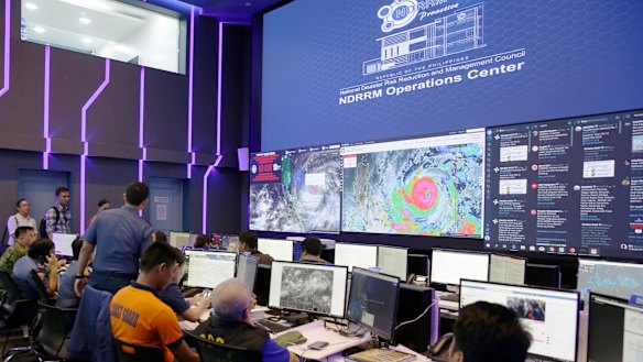 Images of typhoon Mangkhut, locally named "Typhoon Ompong" are seen at the National Disaster Risk Reduction centre in Manila.