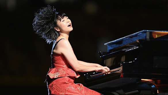 Japanese jazz composer Hiromi Uehara plays the piano.