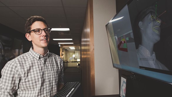 Seeing Machines head of advanced engineering John Noble, pictured demonstrating the company's eye tracking system.