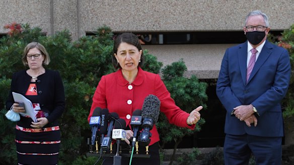 NSW Premier Gladys Berejiklian, with Chief Health Officer Kerry Chant and Health Minister Brad Hazzard, announce the easing of Sydney's lockdown restrictions for the Christmas period on Wednesday. 