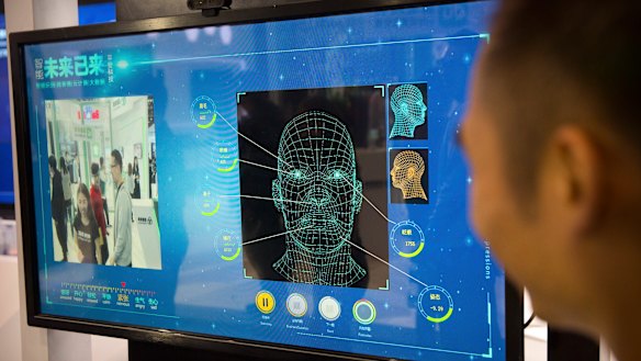 A facial recognition display by Chinese tech firm Ping'an Technology at the Global Mobile Internet Conference in Beijing. 