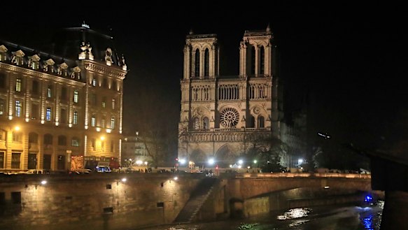 Notre Dame Cathedral is lit up in Paris.
