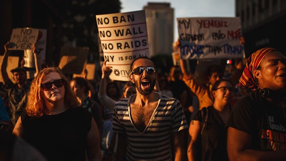 People protest the Supreme Court's decision to uphold President Donald Trump’s travel ban, in New York.