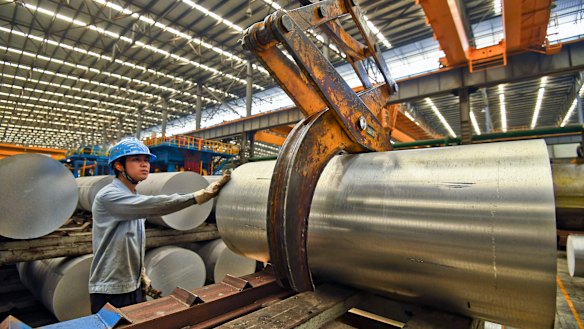 A worker transfers an aluminium product at a factory in Nanning in south China's Guangxi Zhuang Autonomous Region.