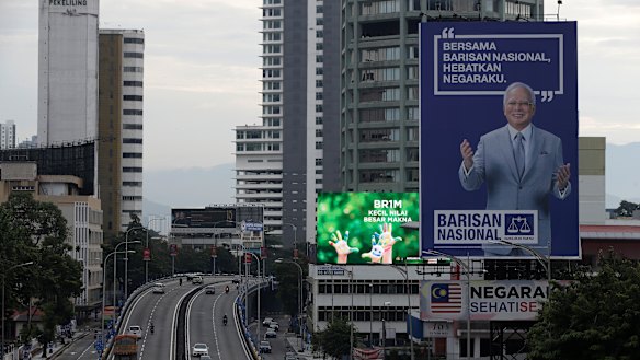 Fallen idol: A giant campaign billboard of defeated incumbent Najib Razak looms over the highways of Kuala Lumpur.
